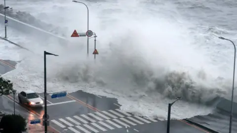 Yonhap/Reuters A road is inundated after Typhoon Hinnamnor made landfall on the southern coast of South Korea, in Pohang, South Korea, 06 September 2022