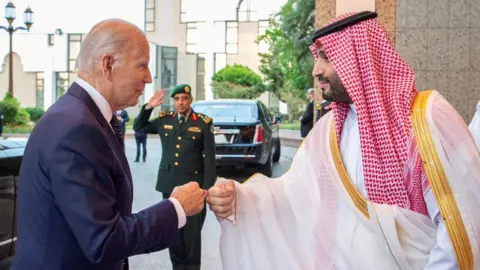 Reuters Saudi Crown Prince Mohammed bin Salman fist bumps U.S. President Joe Biden upon his arrival at Al Salman Palace, in Jeddah, Saudi Arabia, July 15, 2022