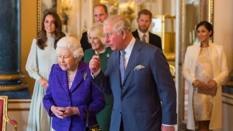 PA Media The Queen, Prince of Wales and other senior royals at a reception at Buckingham Palace in London to mark the fiftieth anniversary of the investiture of the Prince of Wales