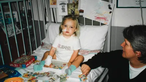 Hattie Stiff Image of Hattie as a child. She is pictured in hospital.