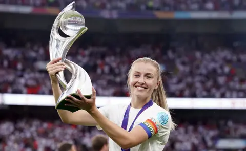 PA Media Leah Williamson with the Euro 2022 trophy at Wembley Stadium