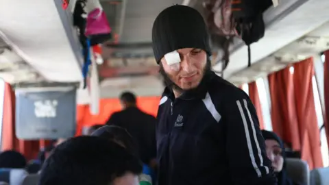 AFP Injured Jaysh al-Islam fighter on board a bus travelling from Douma to northern Syria (5 April 2018)