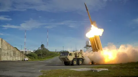 Reuters / Missile Defence Agency A Thaad launcher, resembling a truck with many large upward- pointing launch tubes, fires an interceptor missile on a testing range in an undated handout photo