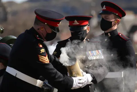 PA Media Members of the 105th Regiment Royal Artillery fire a gun salute to mark the death of Britain's Prince Philip.