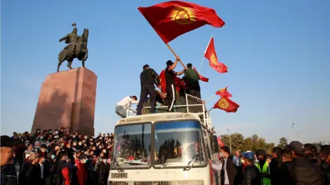 EPA Opposition supporters during a protest against the parliamentary election results at the central square of Ala-Too in Bishkek, Kyrgyzstan, 5 October 2020