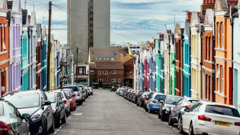 Getty Images Cars parked in a road in Brighton
