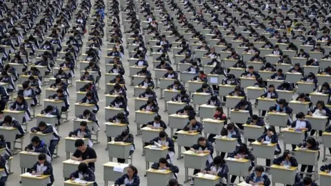 Reuters Students take an examination on an open-air playground at a high school in Yichuan, Shaanxi province 11 April 2015.