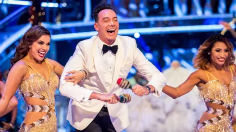 Craig Revel Horwood (centre)