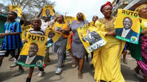 EPA Supporters of the Kenya Kwanza Coalition shout slogans and hold banners as they celebrate the Supreme Court rulling, in Mathare area 4, in Nairobi, Kenya, 05 September 2022.
