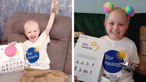 Cancer Research UK Two images separated by a central white line. On the left is Stanley wearing a star awards t-shirt and holding a certificate. On the right is Lily wearing a star awards t-shirt and holding a certificate.