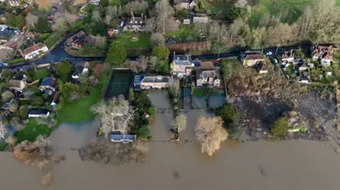 Flood waters reach houses in Pulborough, West Sussex.