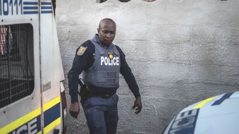 Getty Images Police raid in Cape Town