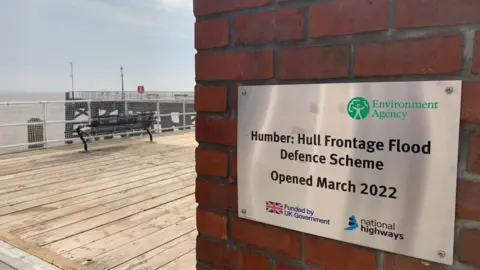 Environment Agency Plaque on the pier wall