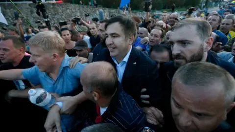 Reuters Former Georgian President Mikheil Saakashvili is surrounded by his supporters as he arrives at a checkpoint on the Ukrainian-Polish border in Krakovets, Ukraine September 10, 2017
