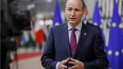 OLIVIER HOSLET Ireland"s Prime Minister (Taoiseach) Micheál Martin arrives for a face-to-face EU summit in Brussels, May 24, 2021.