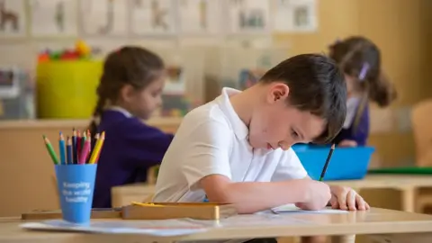 PA Media Children at a school in Norfolk