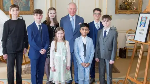 Royal Mail Prince Charles with some of the winning designers at Clarence House