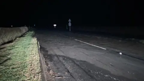 Julia Lewis/BBC Standing water on North Yorkshire road