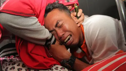 AFP Relatives of the victims