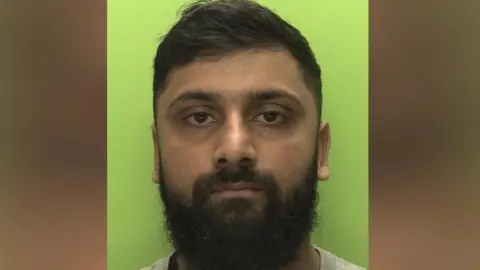 A  police custody shot of Hesaam Ghori