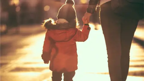 Getty Images Adult and child