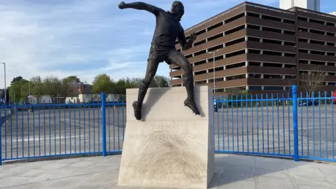 Connor Bennett/BBC Kevin Beattie statue outside Portman Road, Ipswich.