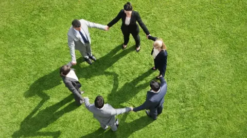 Getty Images People on a work away day