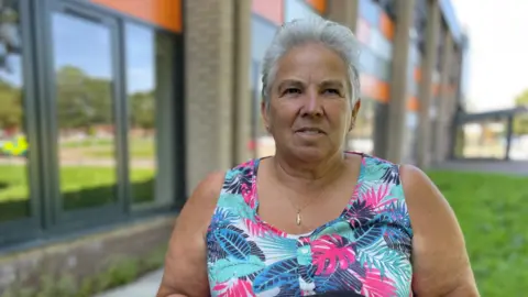 Sheila Mott and the defibrillator she uses to train colleagues at the leisure centre