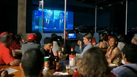 Getty Images The presidential debate projected onto a building in Rio de Janeiro