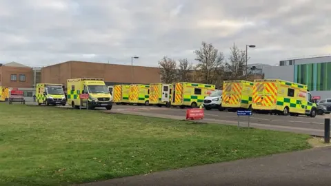 Nikki Fox/BBC Ambulances outside the Norfolk and Norwich hospital