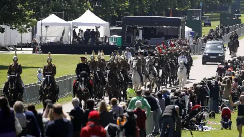 AFP/Getty Images Members of the Household Cavalry Mounted Regiment escort the Ascot Landau carriage pulled by Windsor Grey horses, on the Long Walk during a rehearsal for the wedding procession