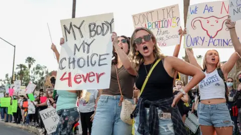 Getty Images Abortion rights protesters chant during a Pro Choice rally at the Tucson Federal Courthouse in Tucson, Arizona on Monday, July 4, 2022.