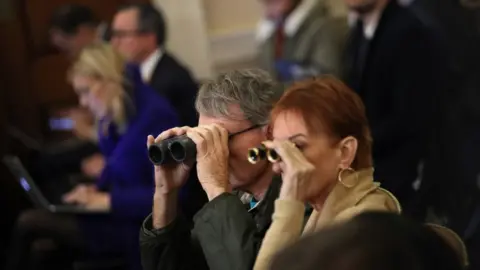 Getty Images Some spectators brought binoculars
