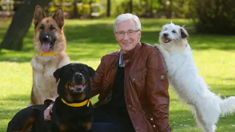 Geoff Caddick Paul O'Grady with dogs