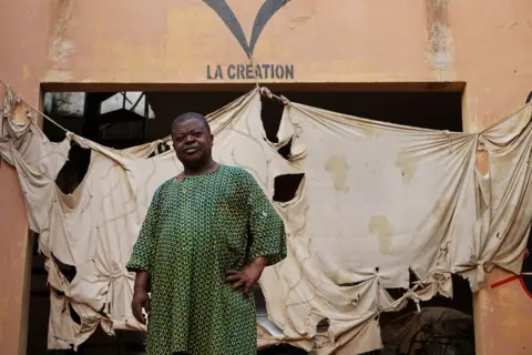 Clair MacDougall Man standing in front of a