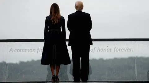 Reuters US President Donald Trump and first lady Melania Trump tour the Flight 93 National Memorial
