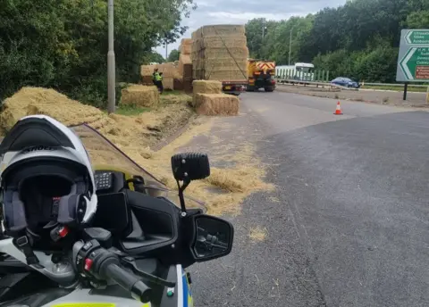 Derbyshire Roads Policing Unit Hay bales fall off lorry on A50, in Aston-on-Trent, Derbyshire