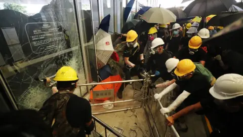EPA Protesters smash their way into the building