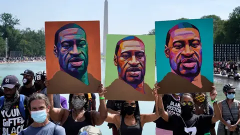 Getty Images Demonstrators listen to speakers near the Lincoln Memorial