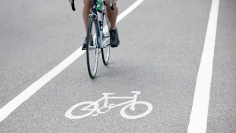 Getty Images Person riding a bicycle on cycle path