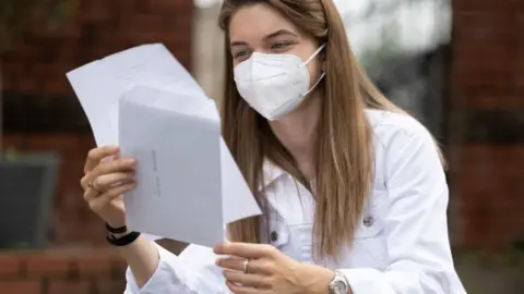 Getty Images Pupil looks at results in Swansea