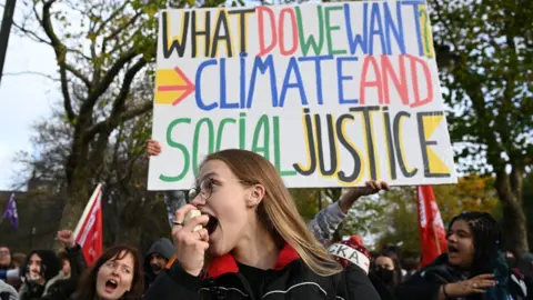 Getty Images Young people protesting at COP26