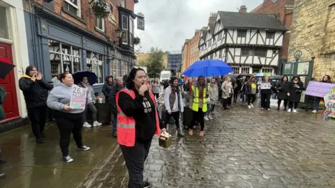 LDRS/JAMES TURNER Corinne Bryan at SEND protest