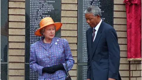 WALTER DHLADHLA/AFP/Getty Images The Queen and Nelson Mandela