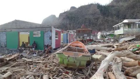 Gemma Handy A boat can be seen lying amid rubble in Soufriere