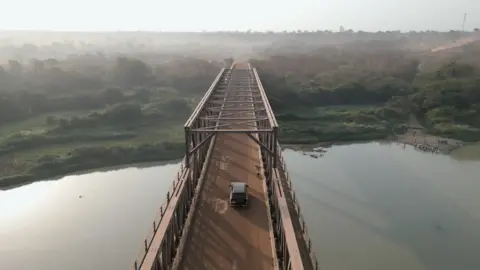 Car going over a bridge
