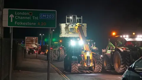 PA Media Tractors driving along a road in Dover