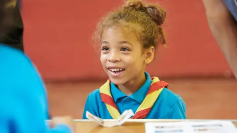 The Scout Association Beaver Scout completes Money badge