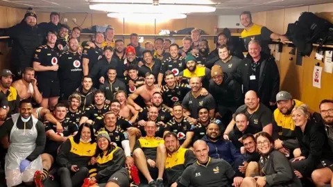 Izzy Greaves Wasps rugby team in a changing room