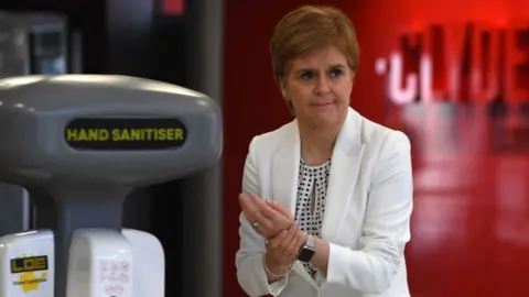 Getty Images Nicola Sturgeon hand sanitiser